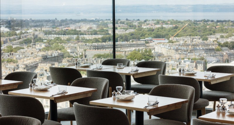 Picture of interior of the Calton Cafe in Edinburgh with views across the city.