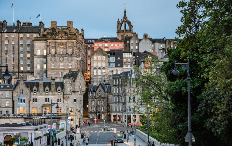 Tourists listening to a guide at Edinburgh Castle
