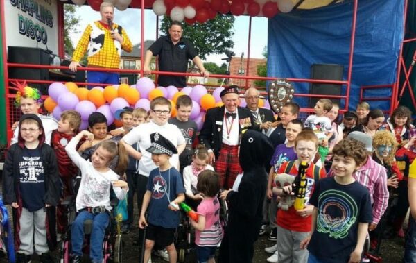 Children in fancy dress with taxi drivers and organisers at the Edinburgh Children’s Taxi Outing.