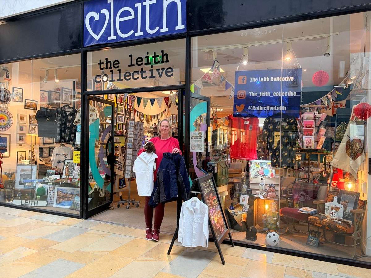 Sara Thomson outside The Leith Collective with school uniform items for the free Edinburgh uniform exchange