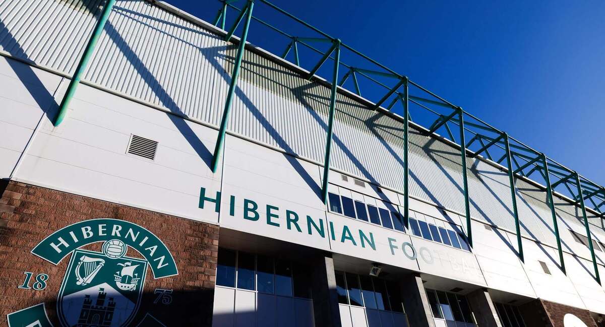Exterior of Easter Road Stadium with Hibernian FC crest and signage in Edinburgh