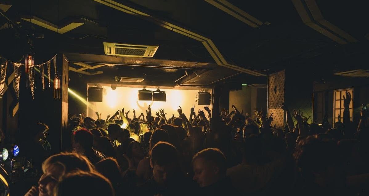 Crowd watching a live performance inside La Belle Angele in Edinburgh