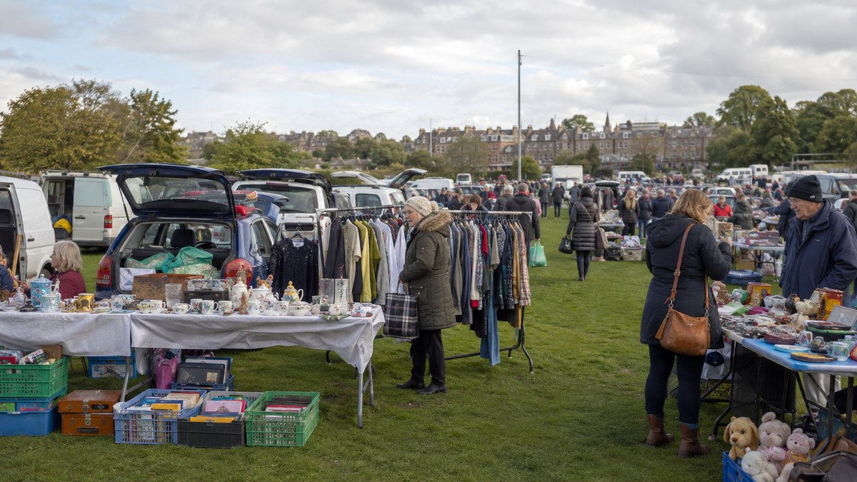 Car boot sale in Edinburgh with stalls, cars, clothes and second-hand goods