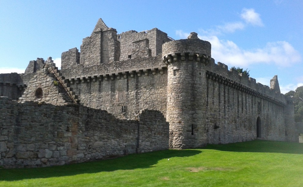 Stone walls and round tower at Craigmillar Castle in Edinburgh