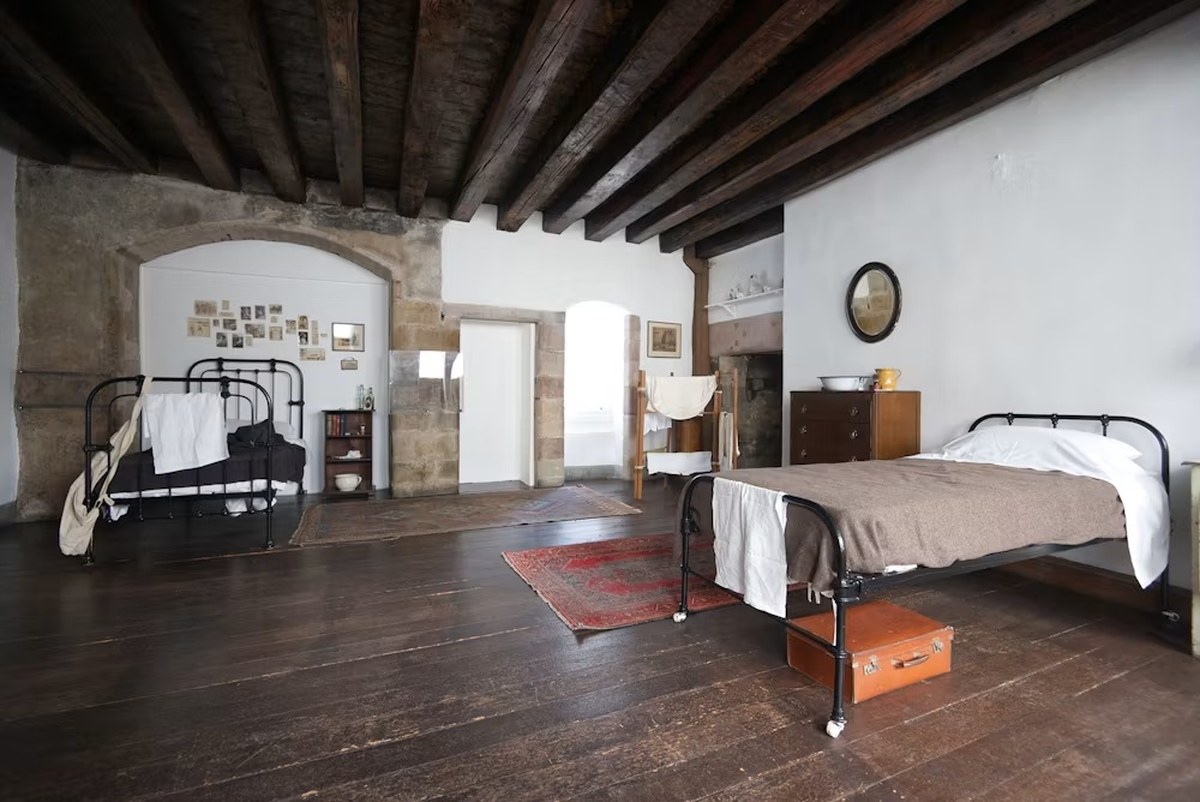 Historic bedroom interior with iron beds at Gladstone’s Land in Edinburgh