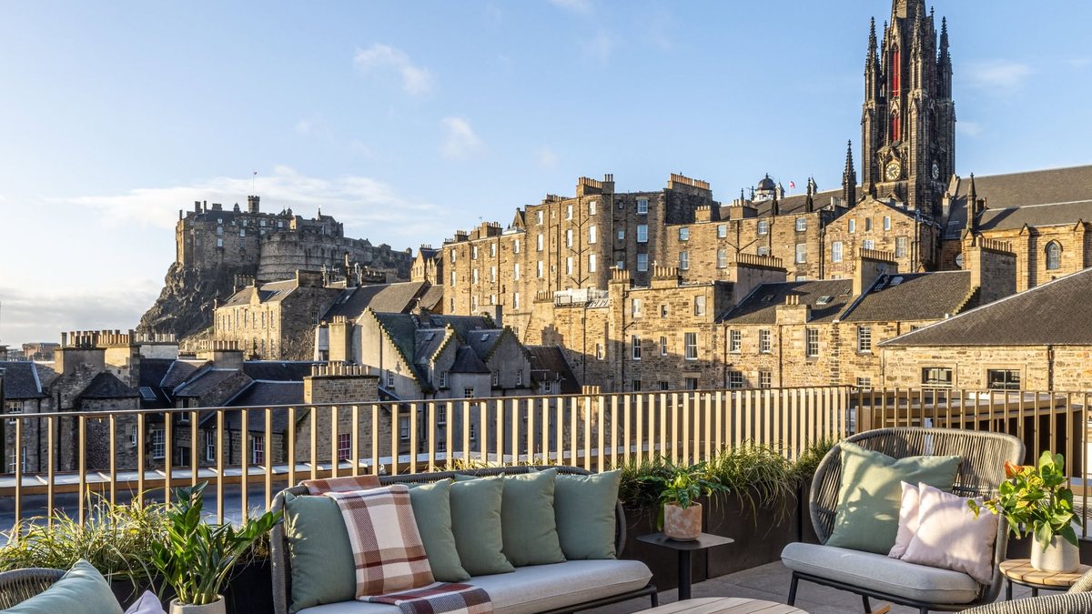 Rooftop terrace at Virgin Hotels Edinburgh with views towards Edinburgh Castle