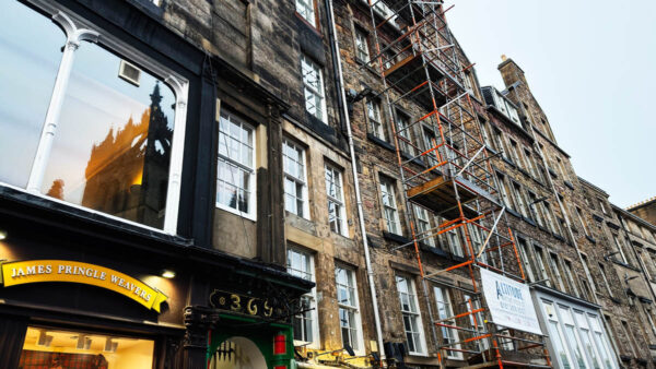 Historic Edinburgh stone buildings with scaffolding during restoration work