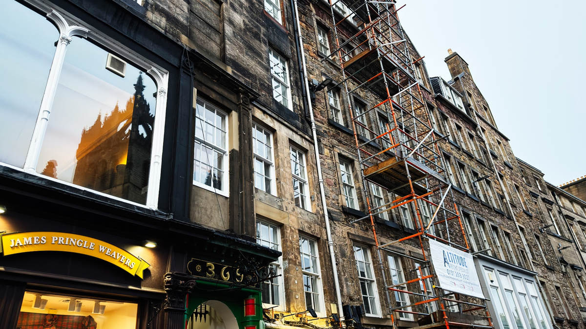 Historic Edinburgh stone buildings with scaffolding during restoration work