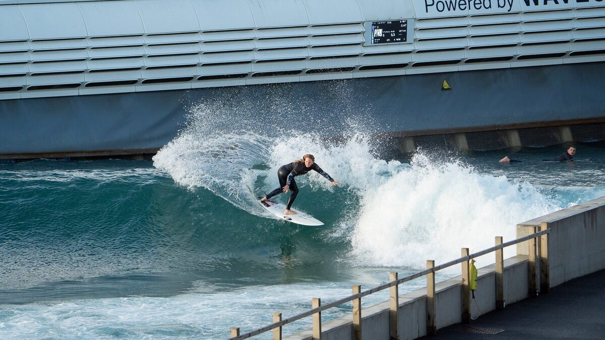 Surfer riding a wave at Lost Shore Surf Resort near Edinburgh